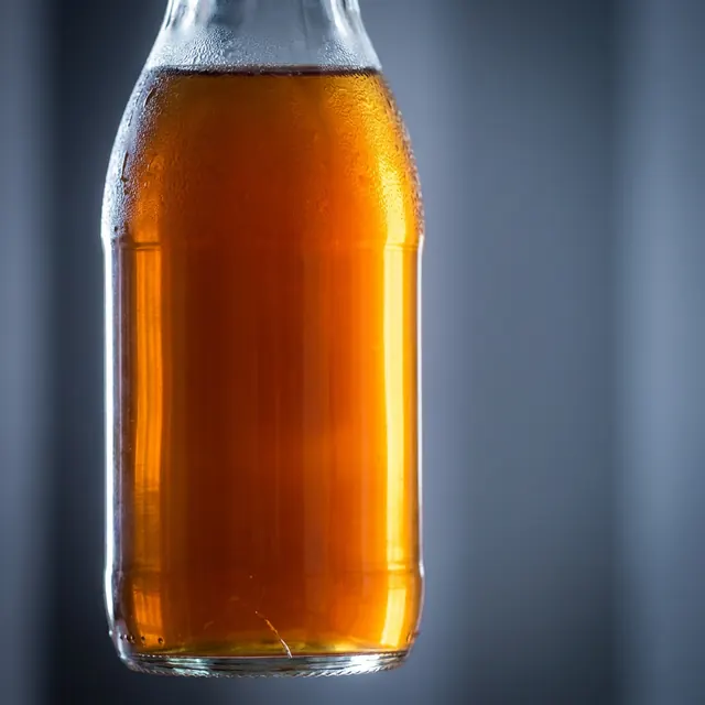 [object Object] — A bottle lit so the liquid inside does the work.